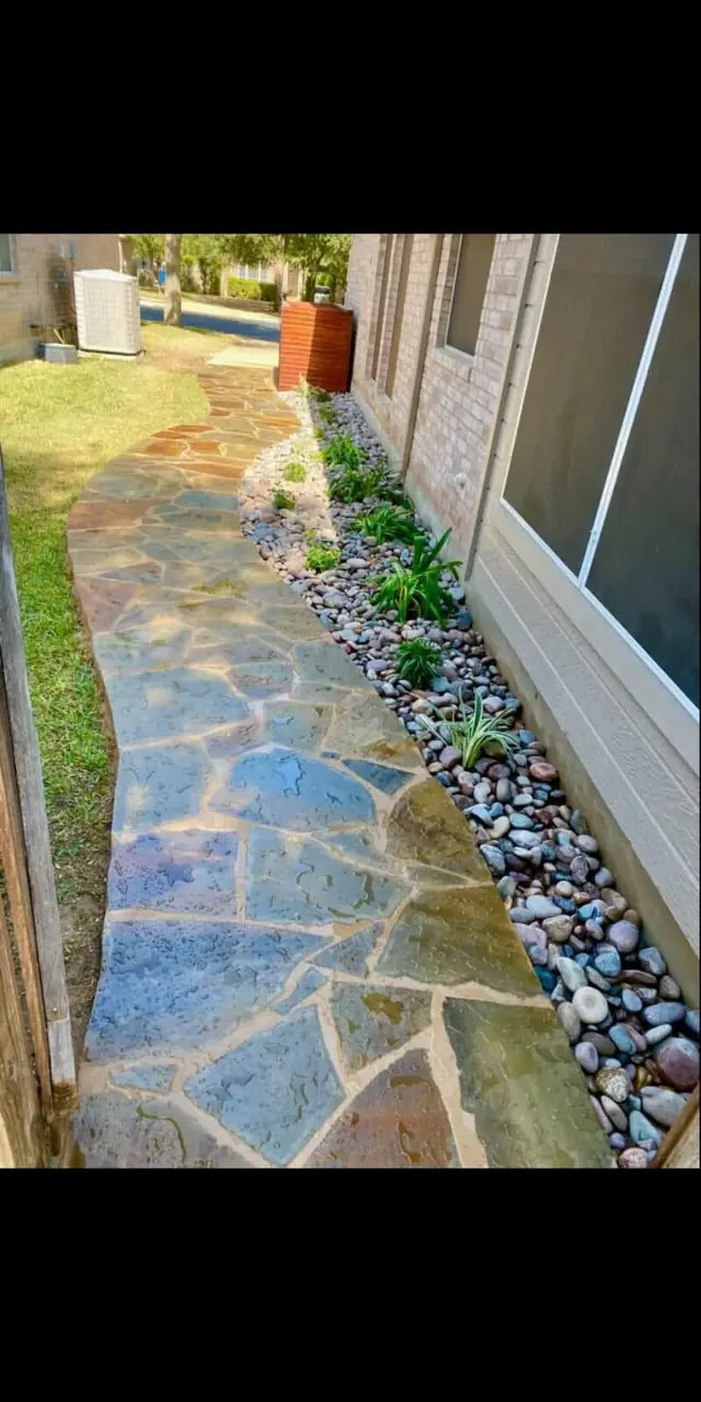 Natural flagstone walkway with river rock