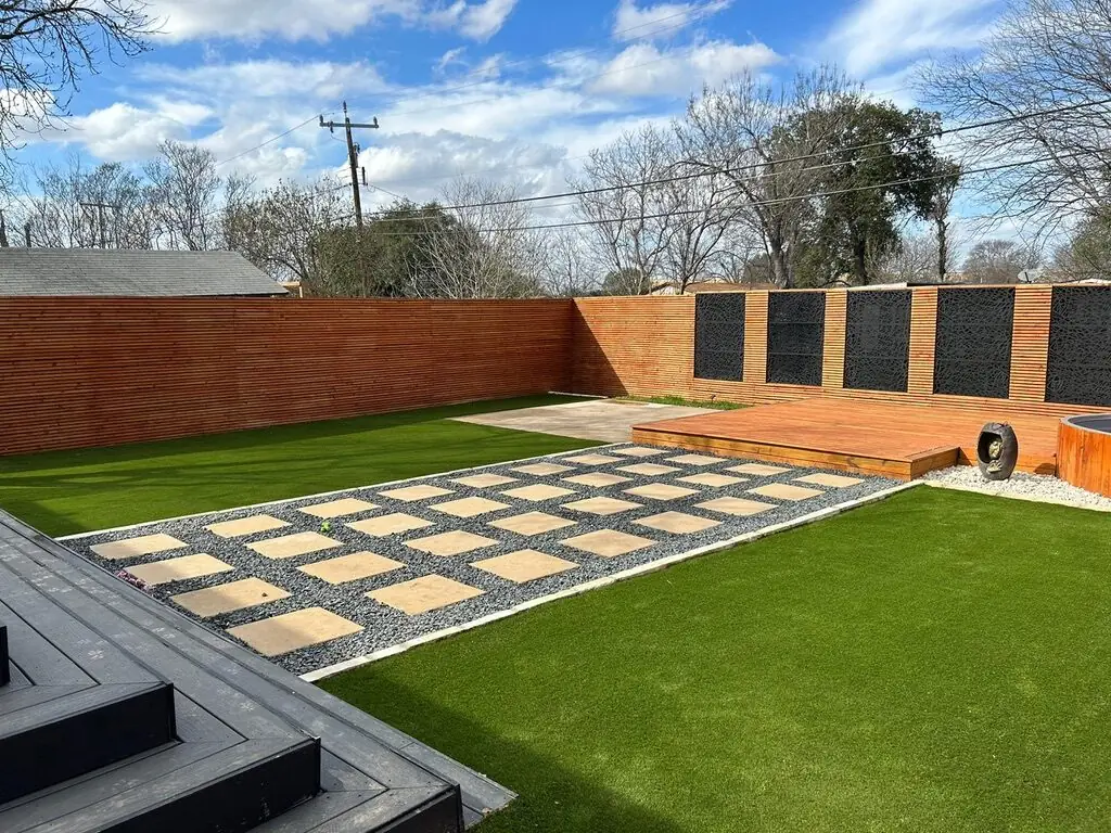 Modern full backyard redesign with pavers and turf